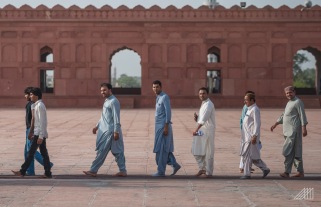 men walking badshahi mosque lahore pakistan photography roaming ralph